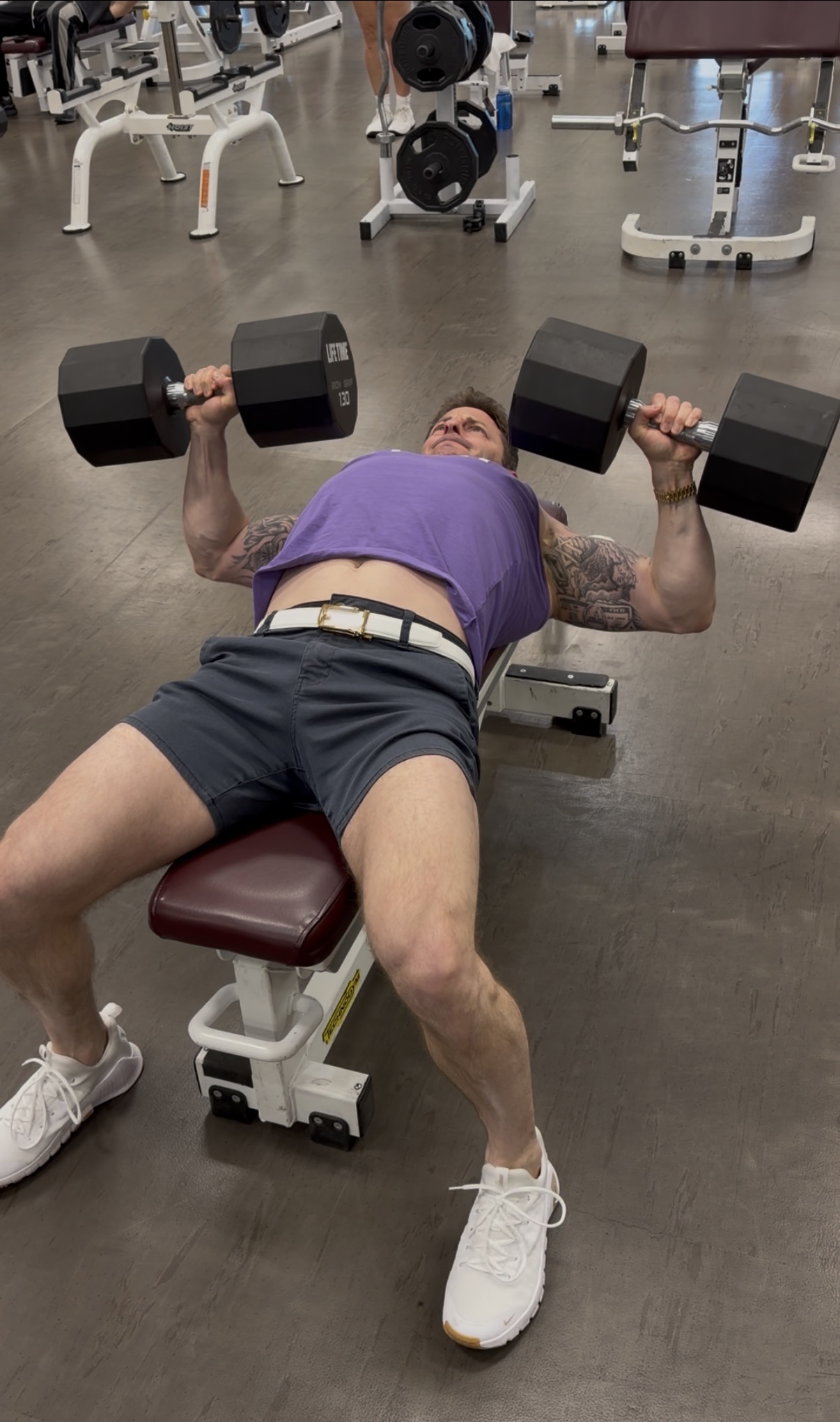 Jeremy Sigal pressing 130-pound dumbbells